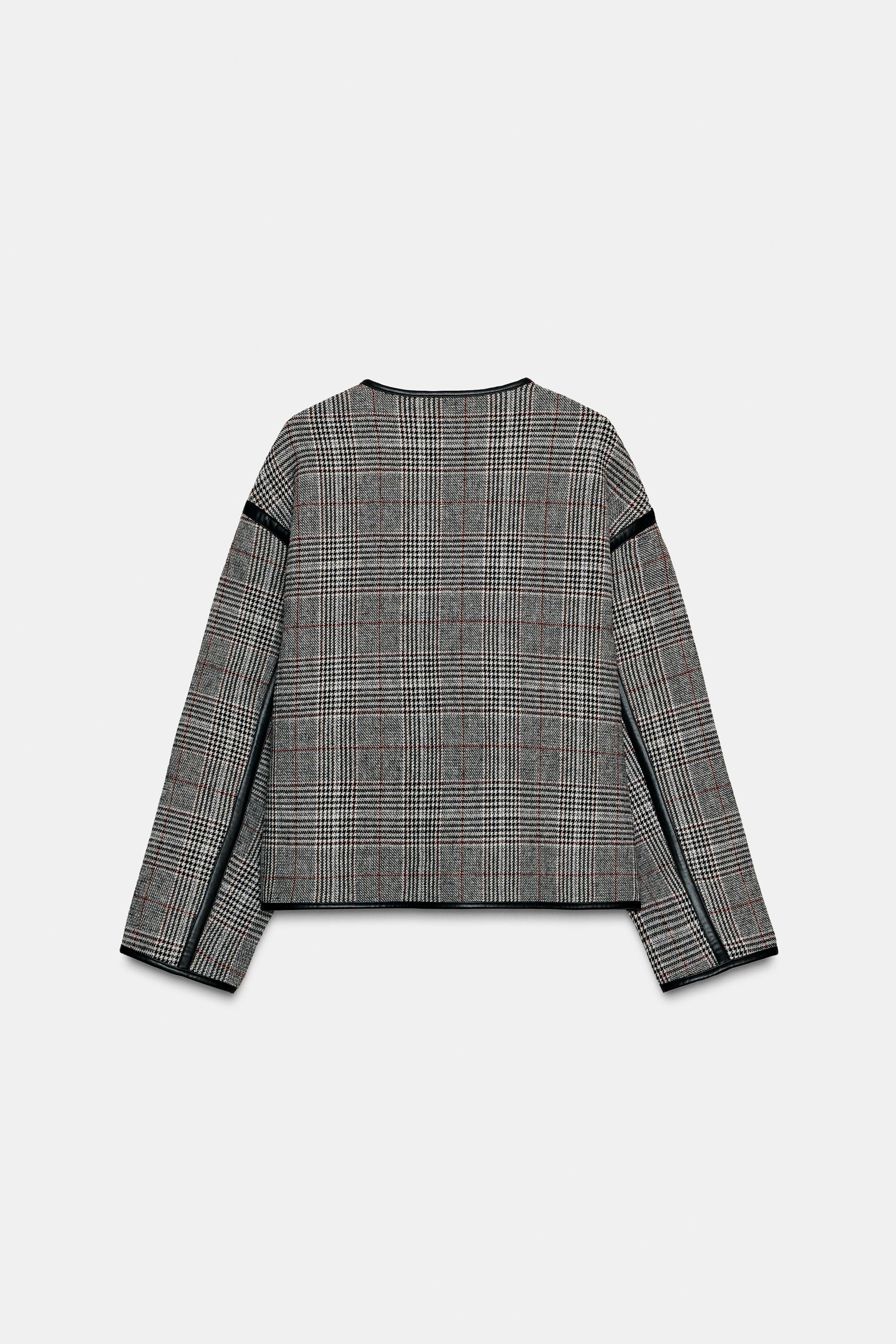 VESTE RÉVERSIBLE À LISERÉS EN MATIÈRE SYNTHÉTIQUE